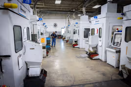 Row of Dynacast die casting machines in Elgin