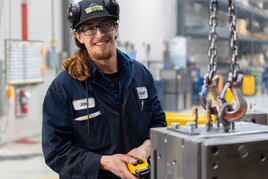 Manufacturing employee operating equipment in Peterborough