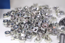 Pile of small square bolts