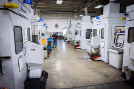 Row of Dynacast die casting machines in Elgin