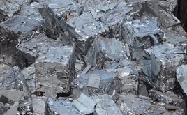 Compacted recycled aluminum in a scrap yard