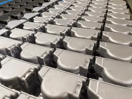 Aluminum metal parts organized in rows for shipment